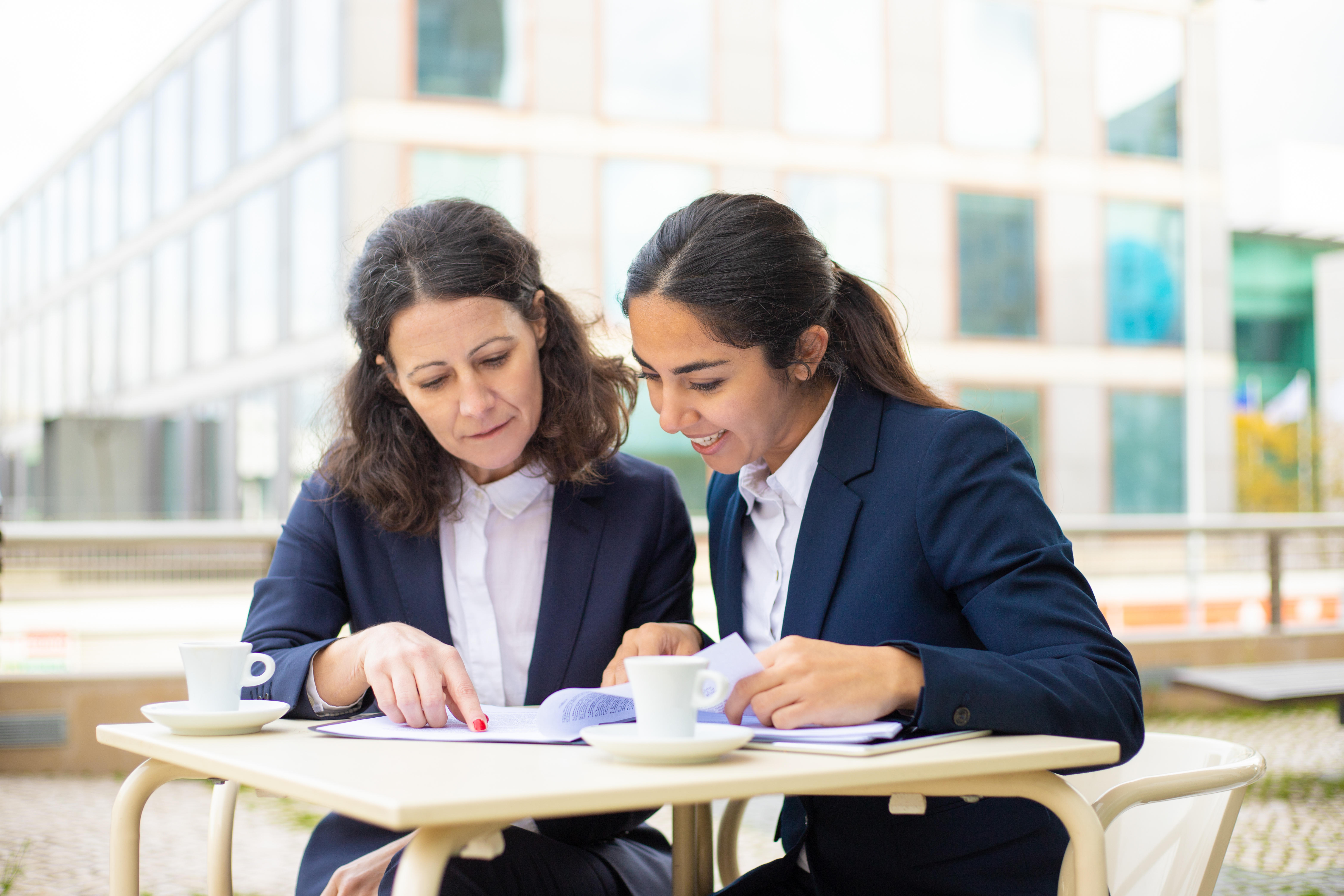 Professional women discussing documents